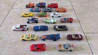 Group shot of all nineteen Hot Wheels vehicles laid out in four rows