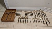 Entire set laid out with basket and all cutlery