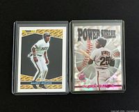 Front view of both Barry Bonds cards in sleeves