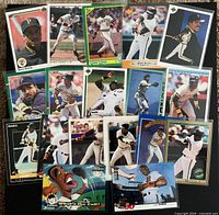 All 18 Barry Bonds baseball cards laid out in grid showing fronts and variety of designs