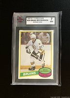 Front of encased Brad McCrimmon rookie card with KSA grade label