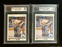 Front view of both encapsulated cards showing Upper Deck designs, player image, grading labels 8.5 and 8.