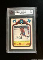 Front of 1978-79 Guy Lafleur #326 card in KSA slab showing grade 7 NM
