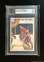 Front view of encapsulated Ken Dryden card showing grade label and card image