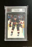 Front of graded Marian Hossa rookie card in KSA slab