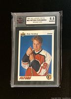 Front of graded card showing Upper Deck Peter Forsberg rookie card in KSA slab with 8.5 NMM+ label