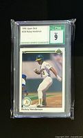 Front view of 1990 Upper Deck #334 Rickey Henderson in CSG slab showing grade Mint 9