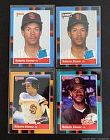 Fronts of four rookie cards in protective sleeves