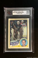 Front of graded Tom Barrasso OPC rookie card slab showing image, grade label
