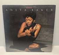 Front cover of Anita Baker Rapture LP showing album art and visible edge wear