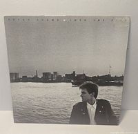 Front sleeve of Bryan Adams Into the Fire LP showing cover art and condition