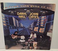 Front sleeve of Daryl Hall & John Oates Bigger Than Both Of Us LP showing artwork and condition