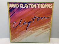 Front cover showing album artwork, writing, edge wear and water damage