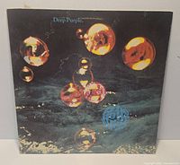 Front cover of Deep Purple Who Do We Think We Are LP with bubble artwork showing overall sleeve condition