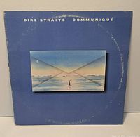 Front cover of Dire Straits Communiqué LP with ring wear