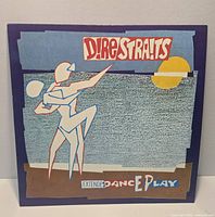 Front cover of Dire Straits "Extended Dance Play" EP showing artwork and condition