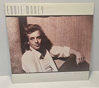 Front jacket of "Can't Hold Back" LP showing artist image and title