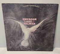 Front jacket of Emerson, Lake & Palmer self-titled LP showing dove artwork and wear