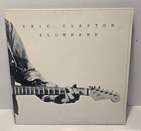 Front cover of Eric Clapton Slowhand LP showing artwork and condition