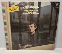 Front cover of Gordon Lightfoot Sit Down Young Stranger LP with hype sticker and visible sleeve wear