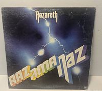 Front cover of Nazareth Razamanaz LP sleeve with wear
