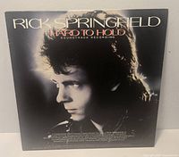 Front cover of Rick Springfield Hard to Hold soundtrack LP showing artist portrait and title