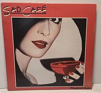 Front cover of Sad Café Misplaced Ideals LP showing artwork and condition