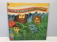 Front cover showing artwork, label logo, wear and handwriting