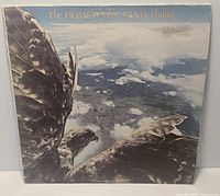 Front cover of The Hometown Band Flying vinyl LP showing artwork and visible sleeve wear
