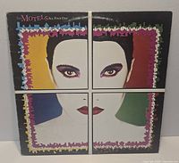 Front cover of The Motels All Four One LP showing artwork and wear