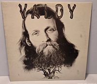 Front cover of Valdy self-titled LP showing portrait artwork and wear