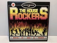 Front cover of Rock It Day & Night LP showing title, artists, artwork and Canadian logo