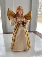 Front view of angel ornament standing on surface