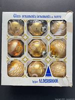 Front of Alderbrook box displaying nine glass ornaments