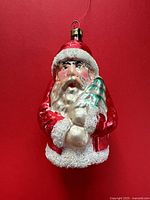 Front view of mercury glass Santa ornament