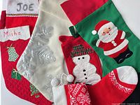 All seven stockings arranged together showing variety of designs