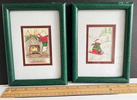 Both framed prints side by side with ruler for scale