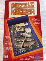 Front of Puzzle Keeper retail box showing product details