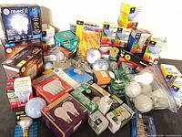 Wide view of entire assortment of boxed and loose light bulbs