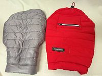 Top view of both dog jackets showing outer shells and colors