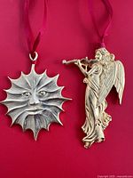 Front view of both ornaments showing design and finish