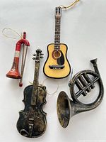 Group of four musical instrument ornaments