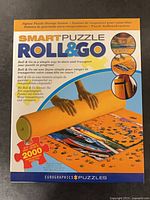 Front of SmartPuzzle Roll & Go box showing mat image and features