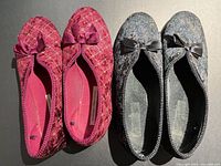 Top view of both slipper pairs showing colors, bows, size labels