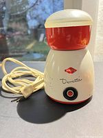 Front and side view showing full grinder with cord and plug