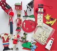 overall view of assorted wooden ornaments on red and white background