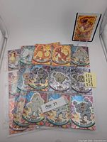 Front view of cards in sleeve showing foil and die-cut Charmeleon