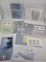 Multiple Canadian marine life stamp sheets in sleeves, including $10 Blue Whale, $12 Atlantic Salmon and others