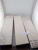 Three long white card storage boxes containing bulk NHL hockey cards