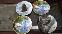 Front view of all four bird plates